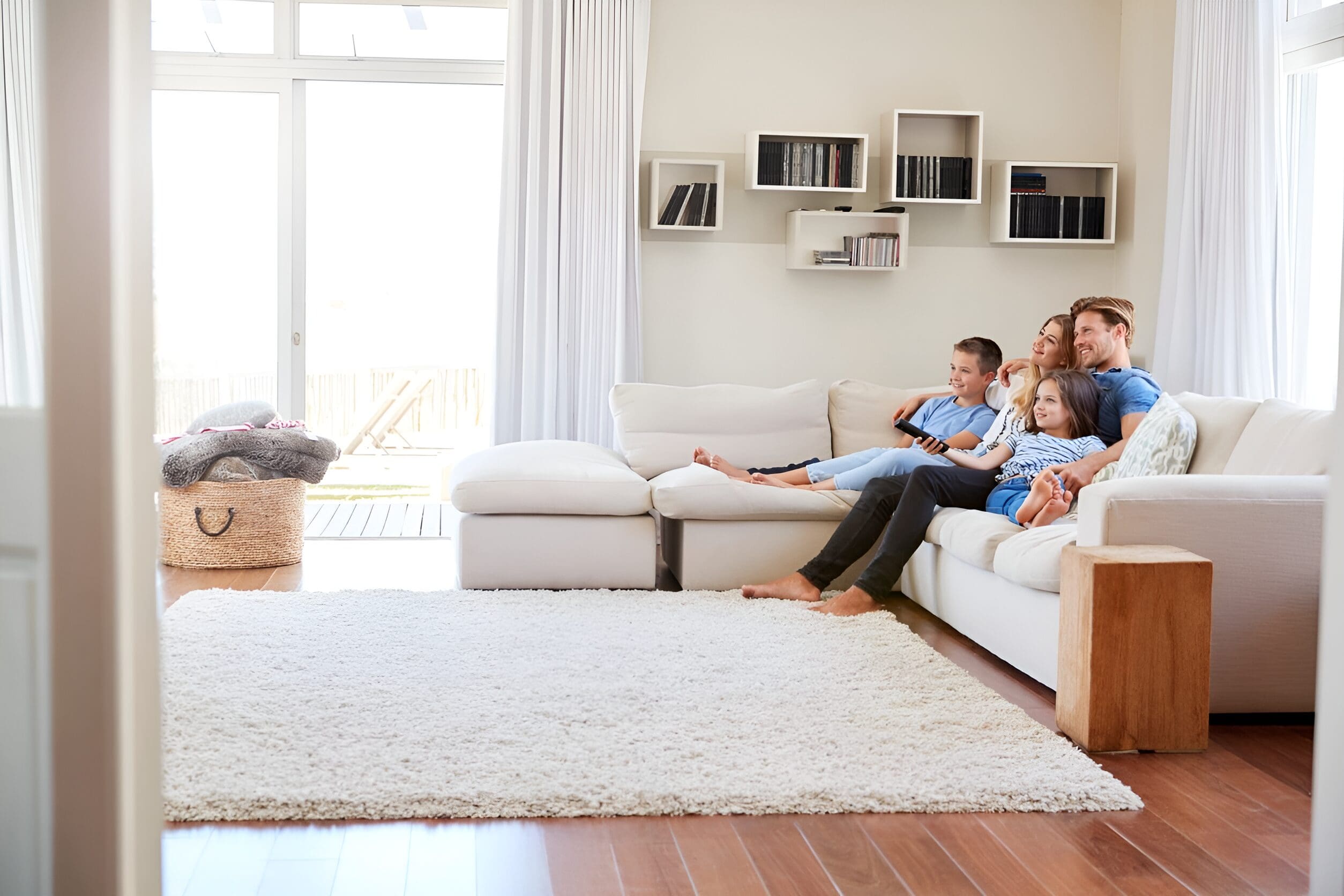 Family watching TV together on the couch